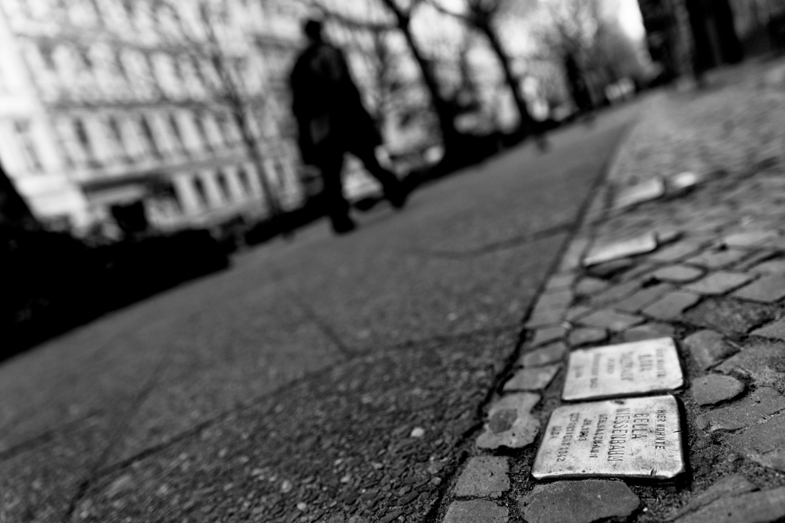 A close shot of a name plate embedded in the street