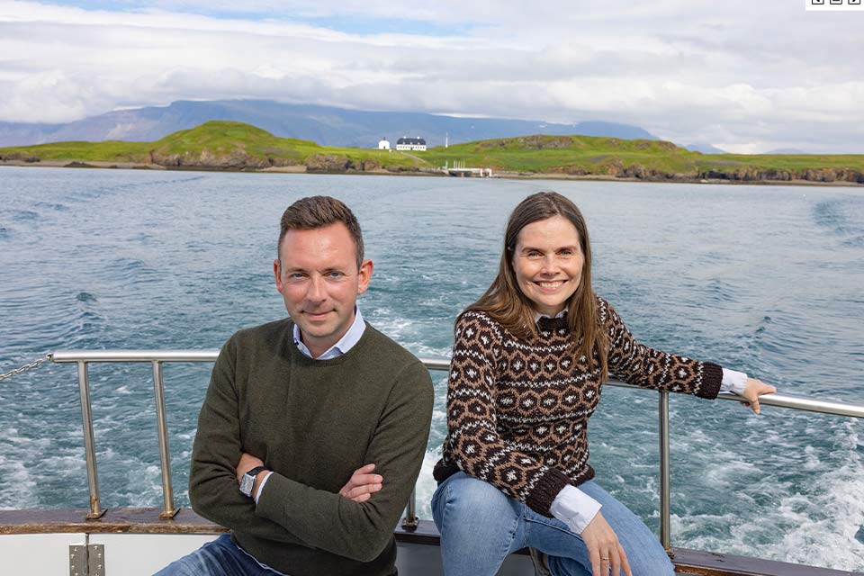 A photograph of Katrín Jakobsdóttir &amp; Ragnar Jónasson on a boat at sea