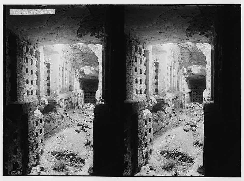 A double exposure of a bombed out alley as seen through a doorway