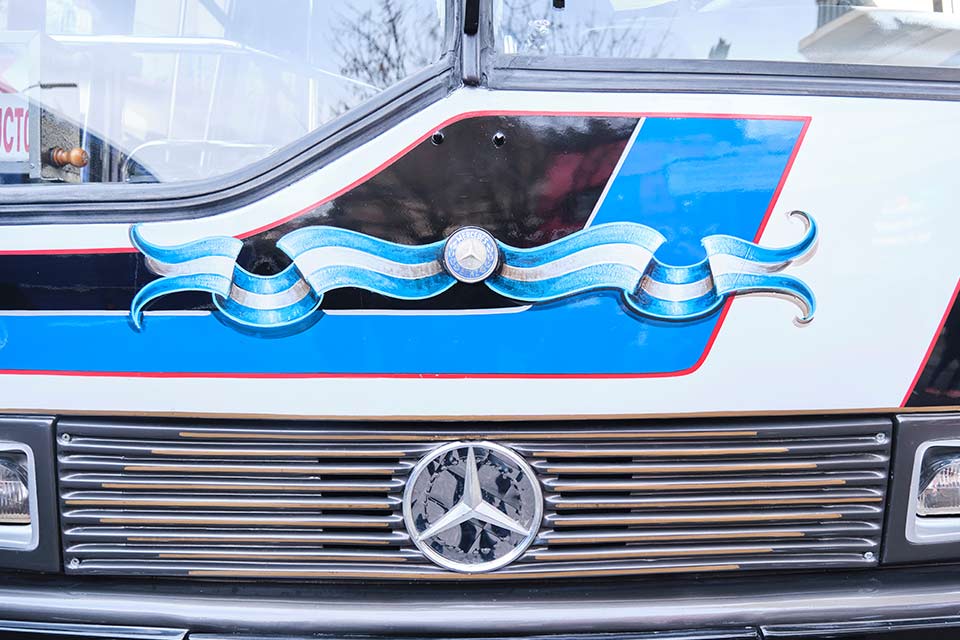 A photograph of the front grill of a bus