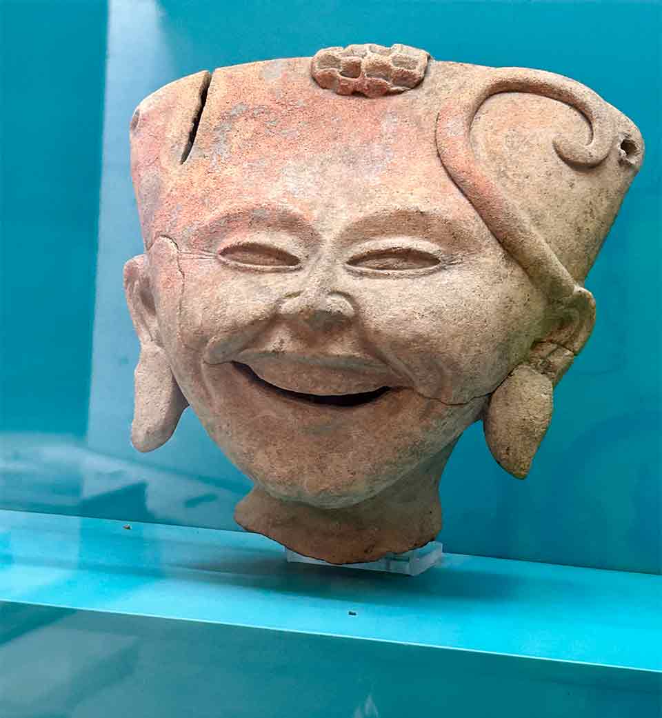 A stylized smiling face sculpture
