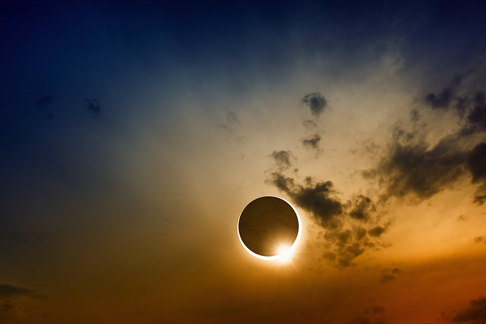 A solar eclipse in a darkened sky
