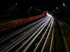 A time-elapsed photograph of cars on a highway at night