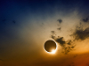 A solar eclipse in a darkened sky