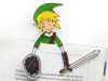 A paper cutout of Link from the Legend of Zelda peeking up from the top of a book