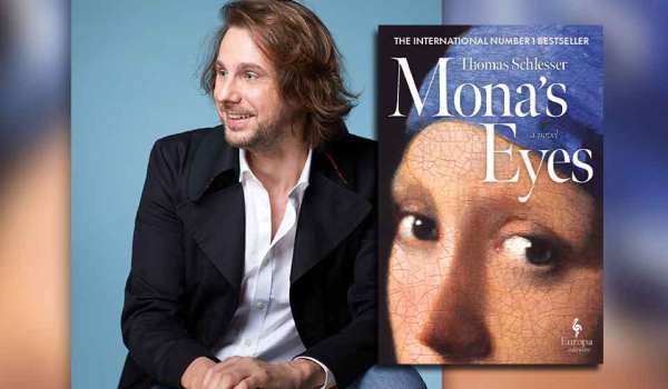 Thomas Schlesser with the cover to his book Mona's Eyes