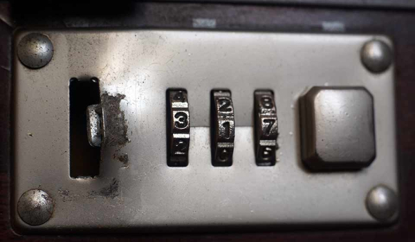A close-up view of a combination lock on a briefcase