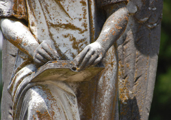 Statue hand writing. Photo by Marsha Brockman/Flickr