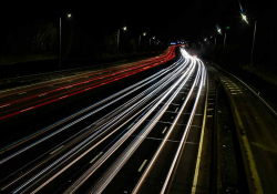 A time-elapsed photograph of cars on a highway at night
