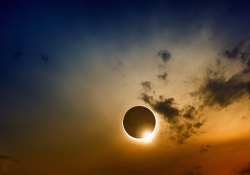 A solar eclipse in a darkened sky