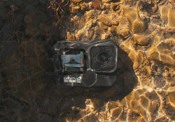 A camera, submerged below clear water