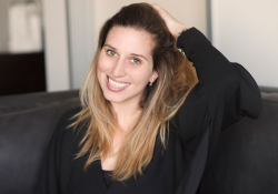 A photograph of Amber Ambrose Aurèle, smiling