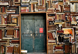Books crowd the entrance to a building in Italy