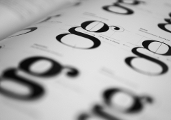 A photo of the lowercase letter "g" repeated over several rows and columns. 