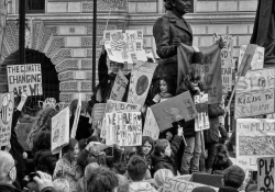 A group of children holding climate change protest signs amass in London