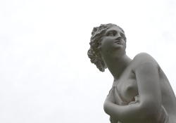 A cropped photo of a Greek statue against a white background