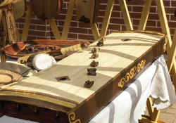 A photograph of a zhetygen, a flat zither